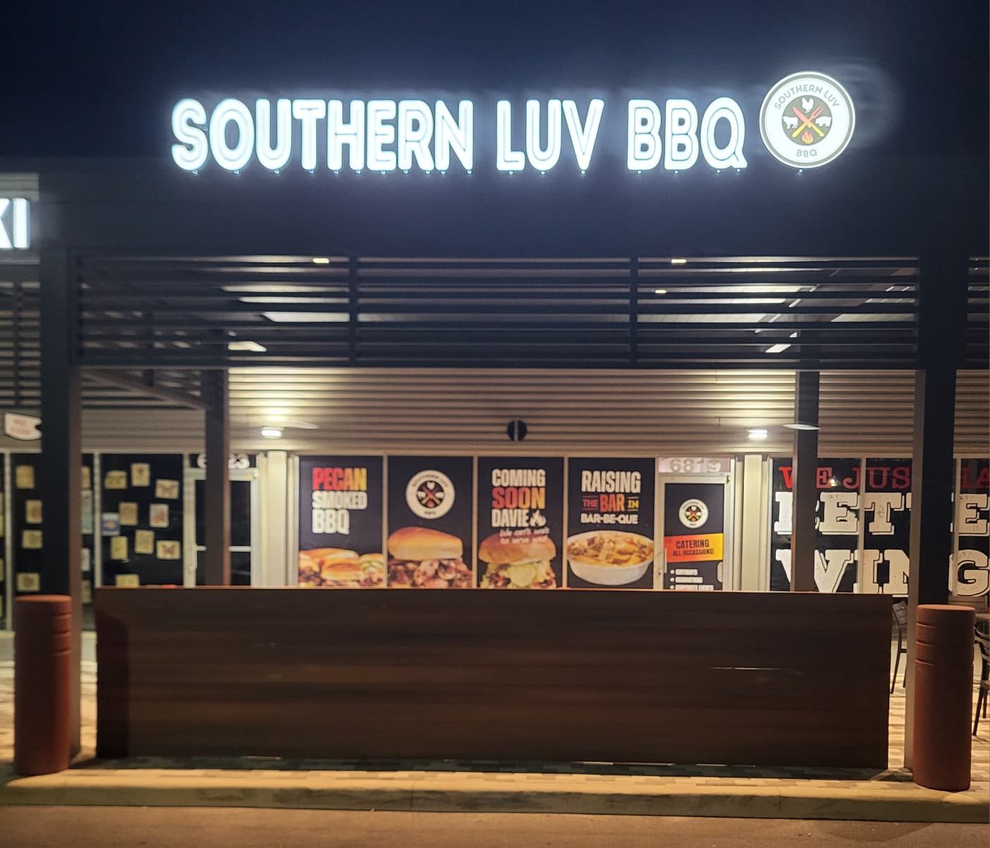 Southern Luv BBQ Davie sign lit up at night on Stirling Road