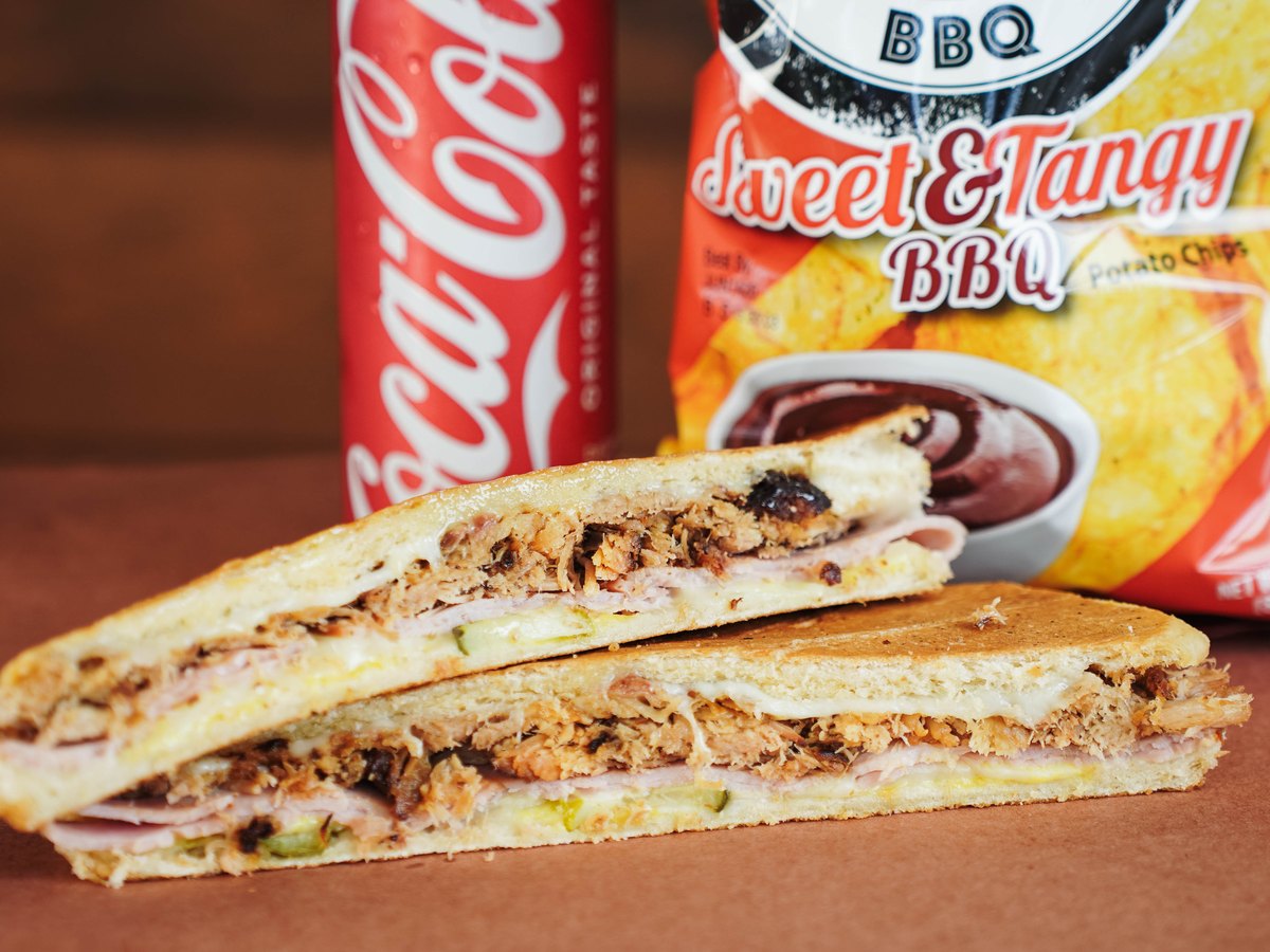 Award Winning Cuban — Pulled pork, smoked ham, Swiss cheese, pickles, and mustard on Cuban bread.