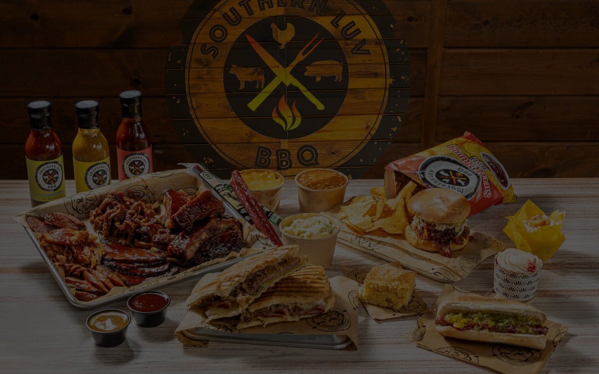 A full spread of Southern Luv BBQ meats, sides and sauces