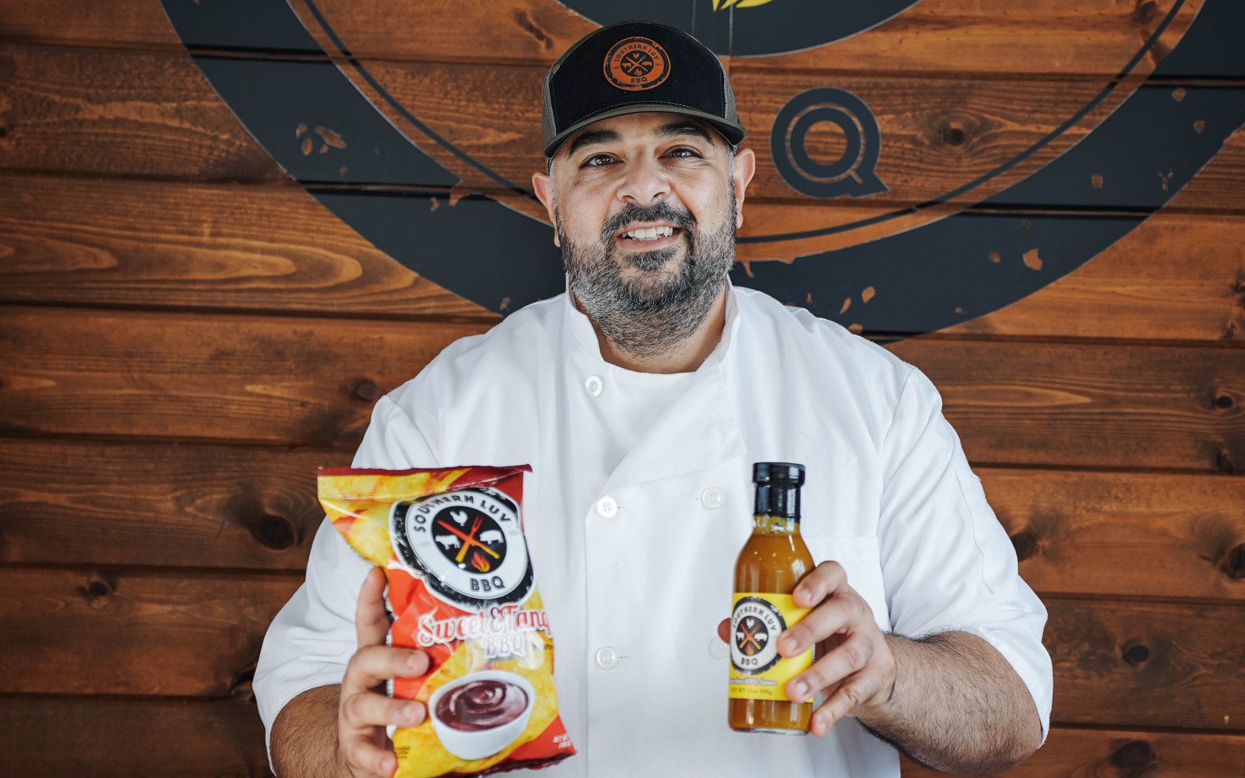 Chef Essi Tadrus holding Southern Luv house-made chips and sauce